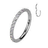A close-up image of a silver-colored crystal pave clicker earring, showing the detail of the crystals on the hoop.