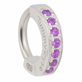 Silver ring with purple gemstones on a white background