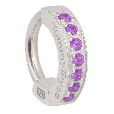Silver ring with purple gemstones on a white background