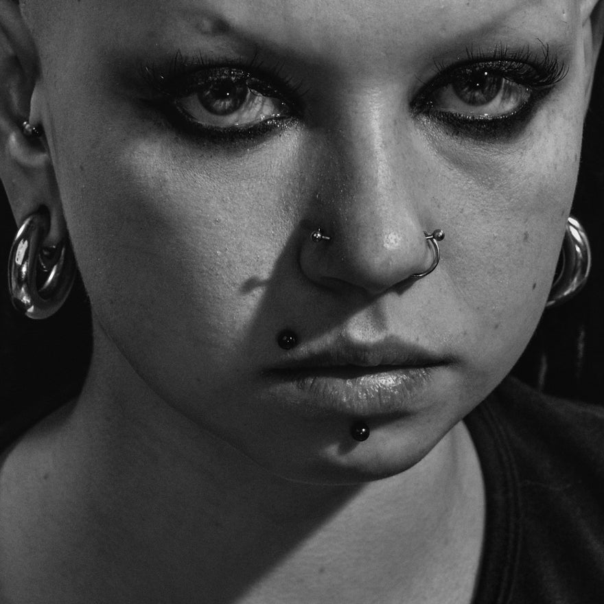 person wearing hoop earrings