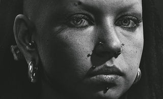 grayscale photo of womans face