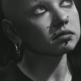 grayscale photo of womans face