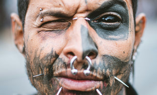 man with silver nose piercing