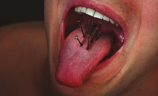 person with tongue out in mouth