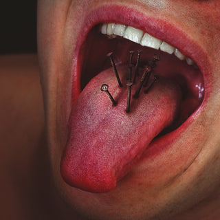 person with tongue out in mouth