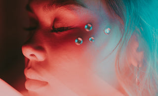 a woman with piercings on her face