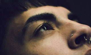 a close up of a person with a nose piercing