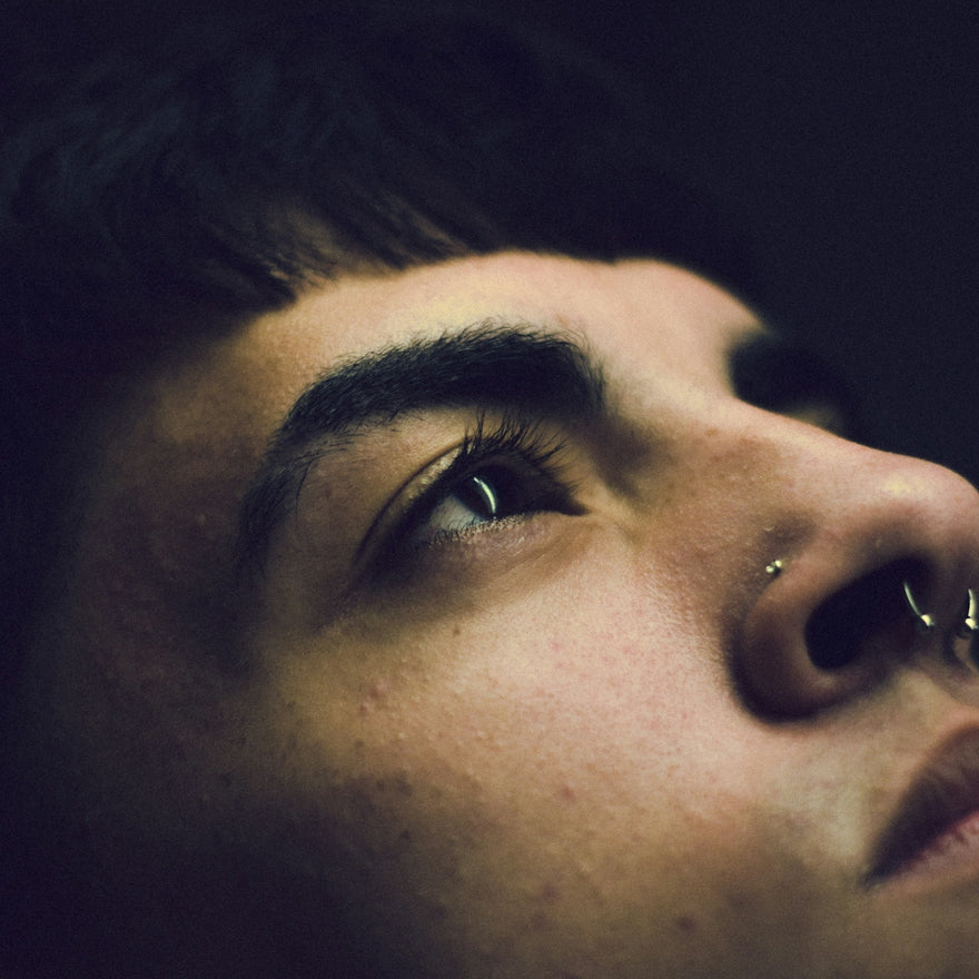 a close up of a person with a nose piercing