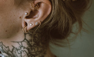 a woman with a tattoo on her ear