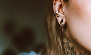 a woman with a tattoo on her neck