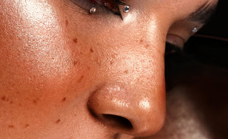 a close up of a woman with freckles on her face