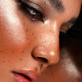a close up of a woman with freckles on her face