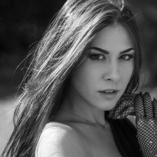 a black and white photo of a woman with long hair